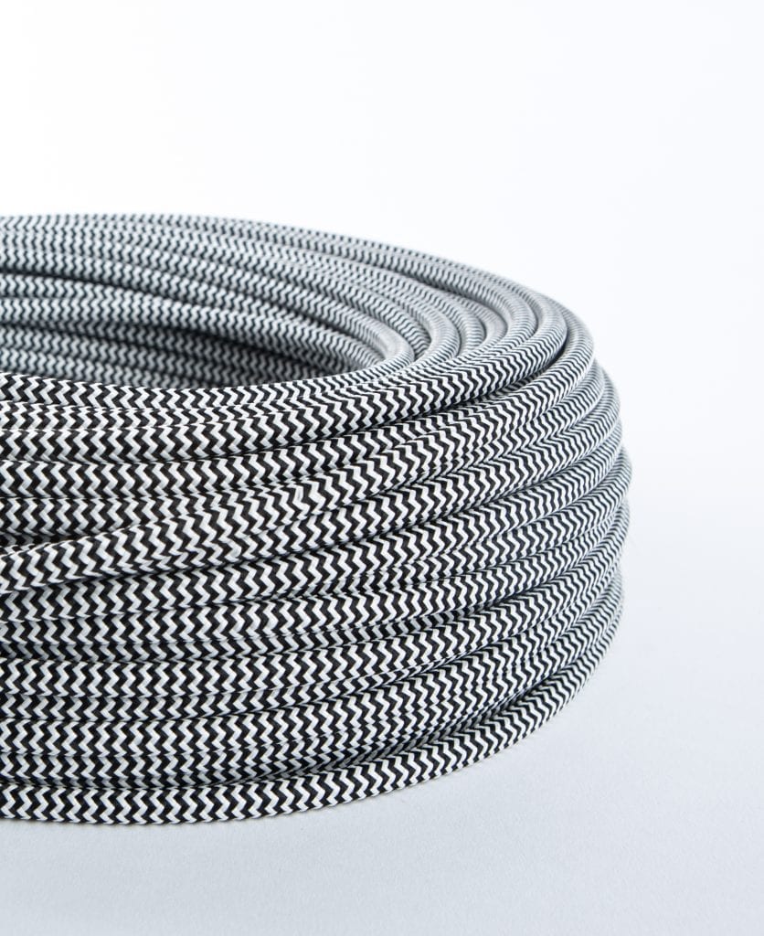 black and white fabric cable against white background
