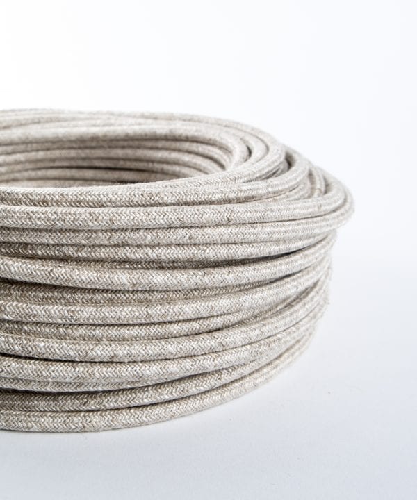 closeup of linen fabric cable coil against white background