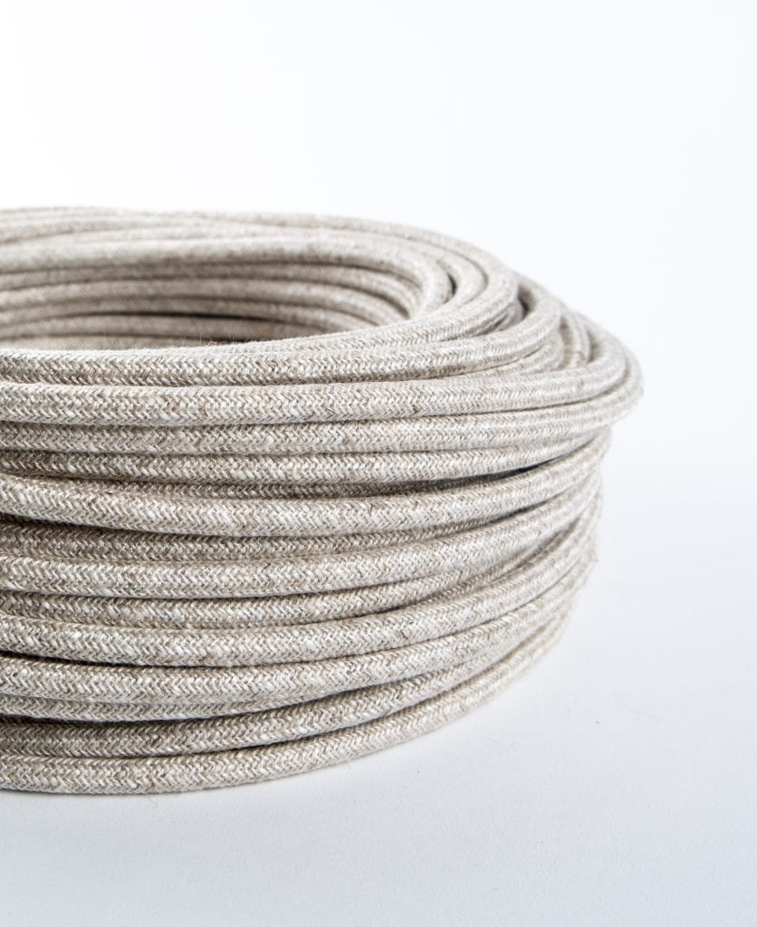 closeup of linen fabric cable coil against white background