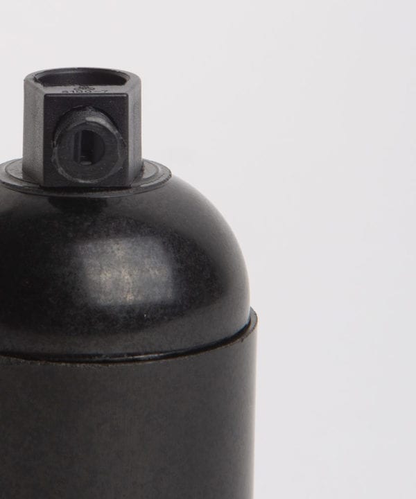 closeup of black thermoplastic lamp holder against white background