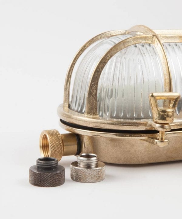 gold bulkhead with 20mm conduit adapter attached, with silver adapter and bronze adapter on white background