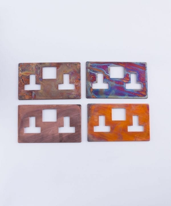 tarnished copper switch plate variations four plates on a white background