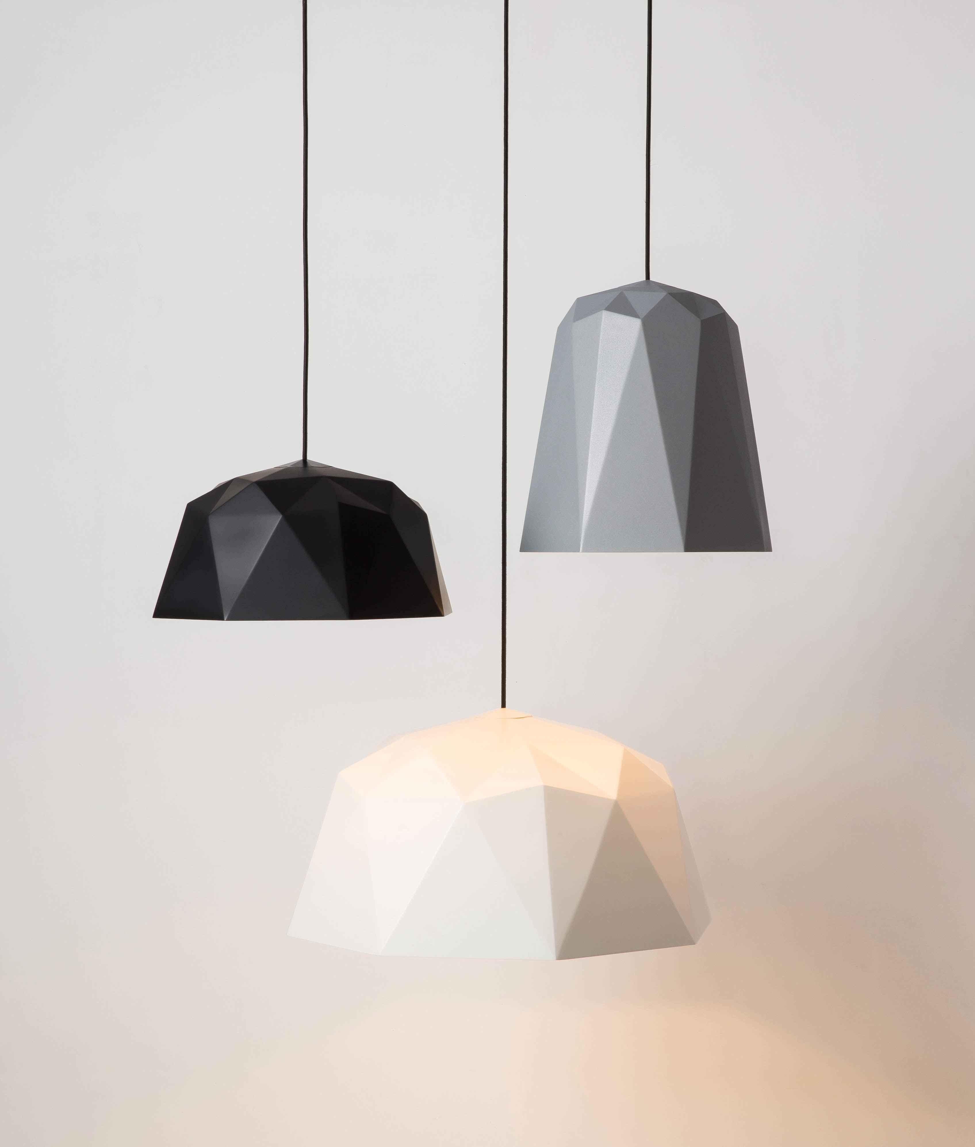 new geometric pendant light shade range suapended against a white background