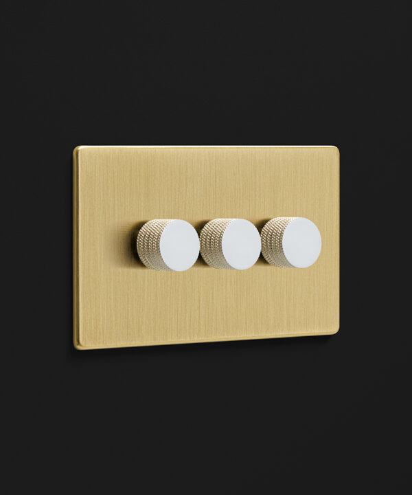 gold triple dimmer with white knurled knobs
