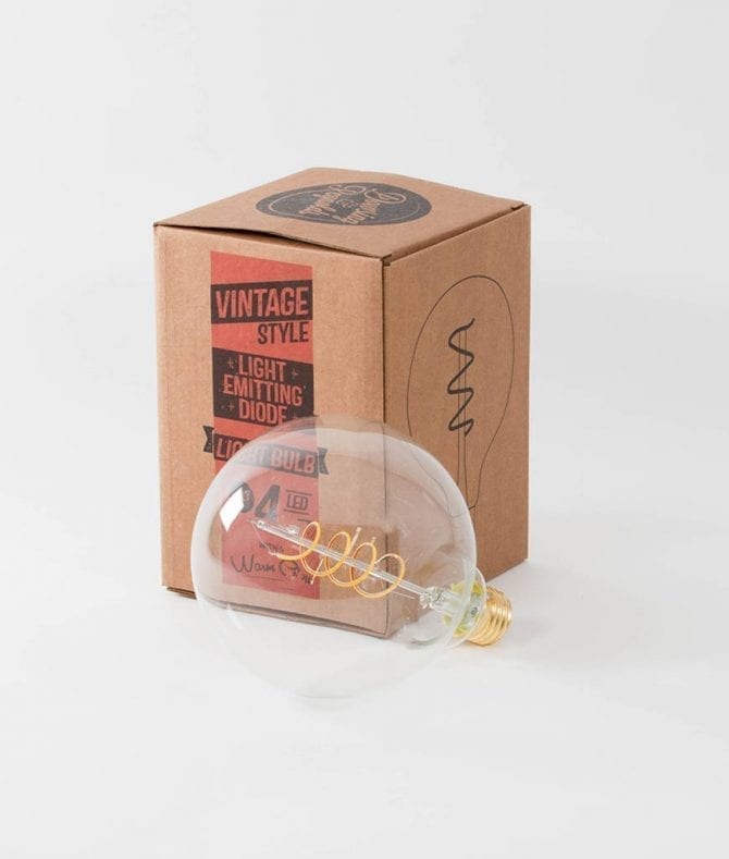 led globe bulb with cardboard packaging against white background