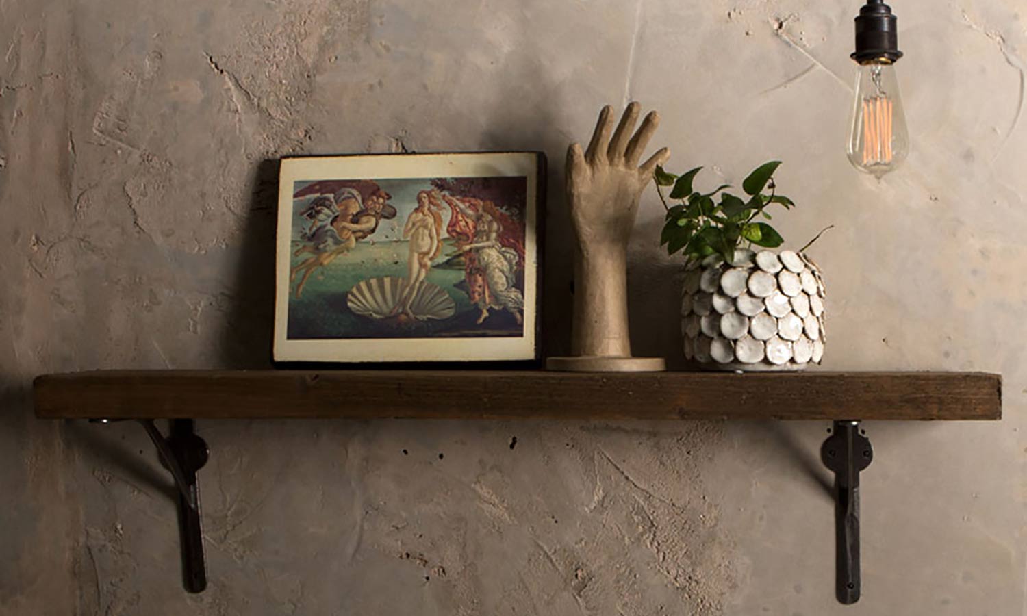 wooden shelf on plastered wall with metal shelf brackets