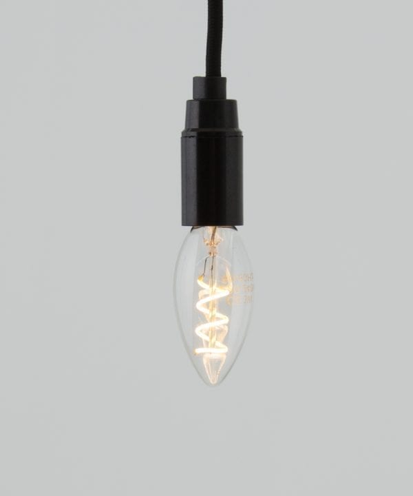E14 LED candle bulbs with spiral filament against white background