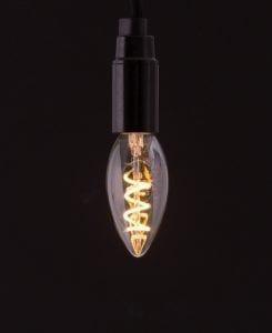 E14 LED candle bulbs with spiral filament against black background