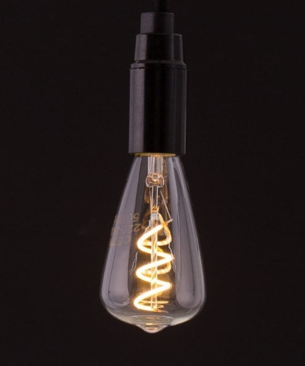 pear shaped LED E14 bulbs with spiral filament against black background