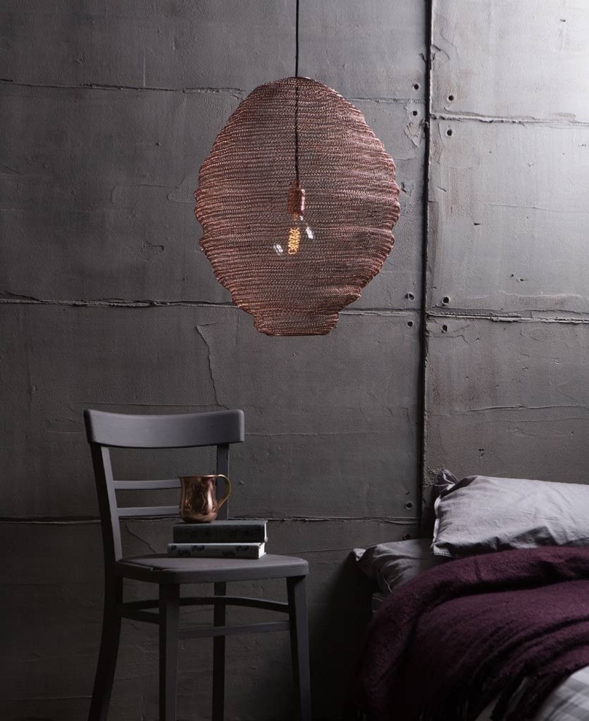 Baya Nest Lights against faux concrete wall in grey bedroom