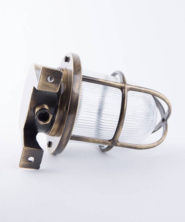 back view of simon aged brass bulkhead light against white background