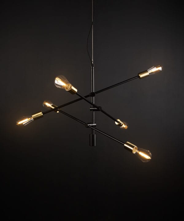 black modern chandelier with clear pear bulbs against black background