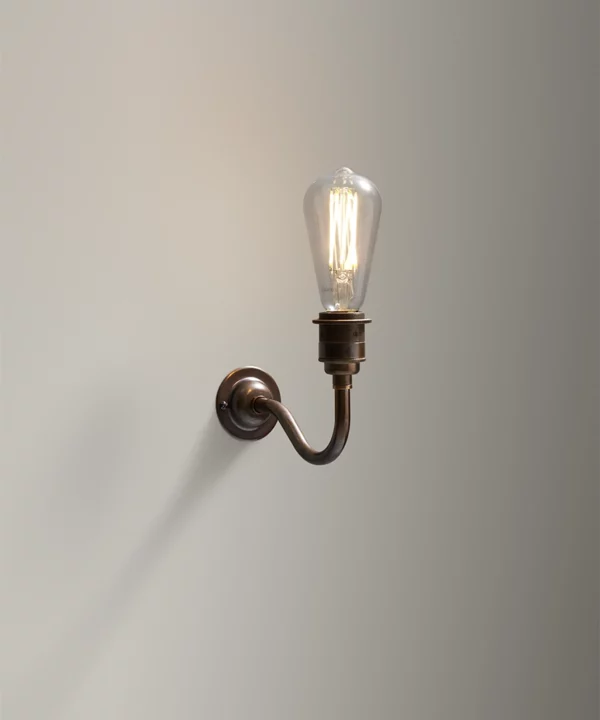 Bramely Brewer's Brass wall sconce with industrial style squirrel cage light bulb
