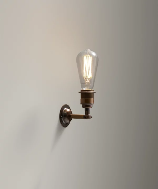 heritage style wall light in aged bronze finish with filament light bulb