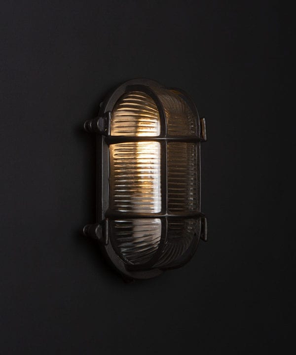 pewter steve bulkhead with wingnuts on black background with bulb