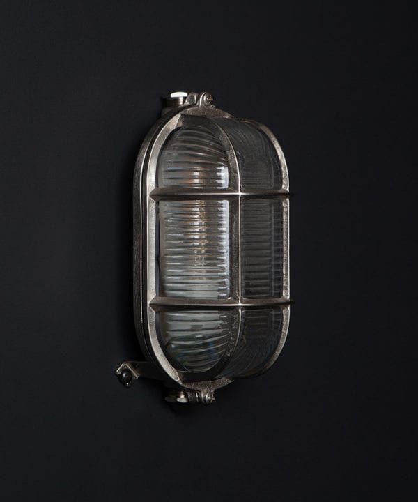 unlit silver dave outdoor bulkhead light on black background