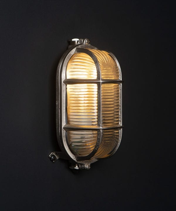 silver dave lit outdoor bulkhead light against black background