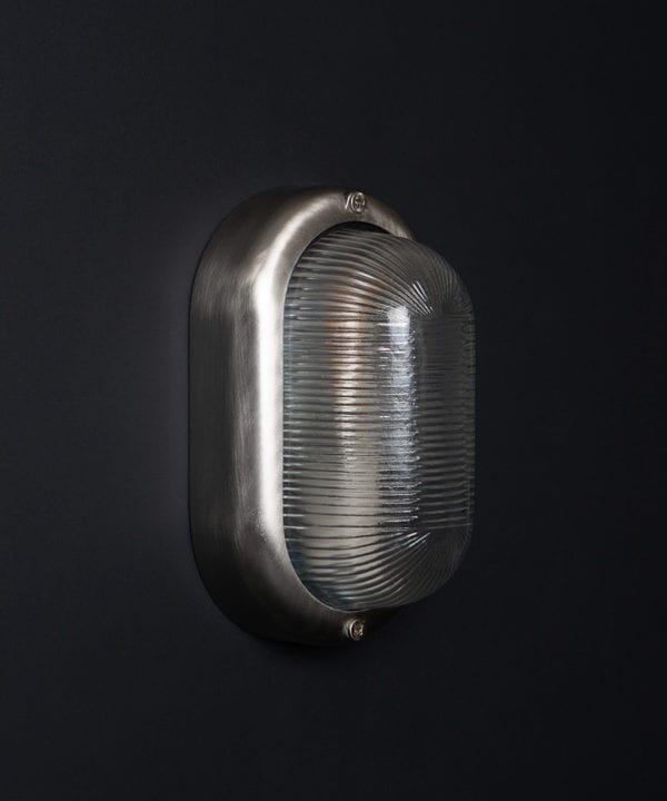 unlit silver mike led outdoor bulkhead light on black wall