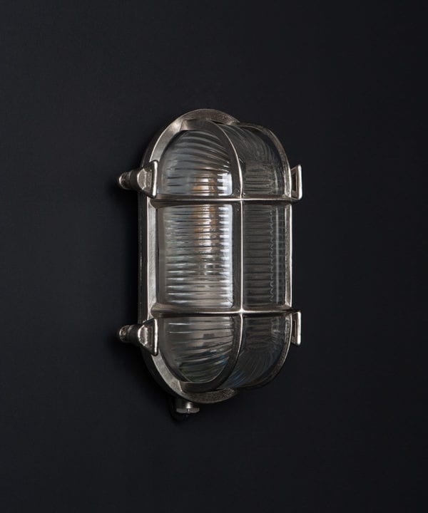 steve silver bulkhead outdoor lights with unlit bulb against black background