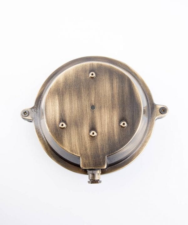 back view of mark aged brass against white background
