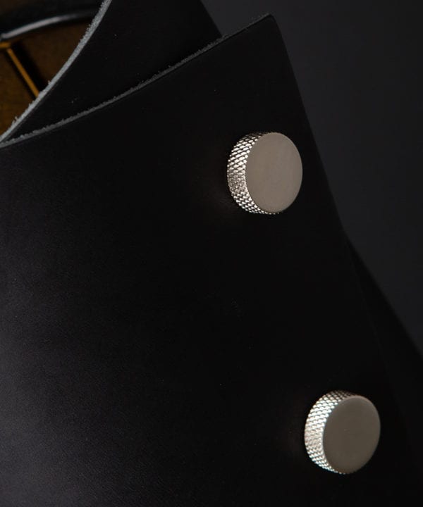 Black and Silver Leather Cuff Table Lamp Close Up against black background