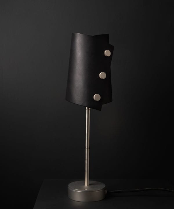 Black and Silver Leather Cuff Table Lamp against black background