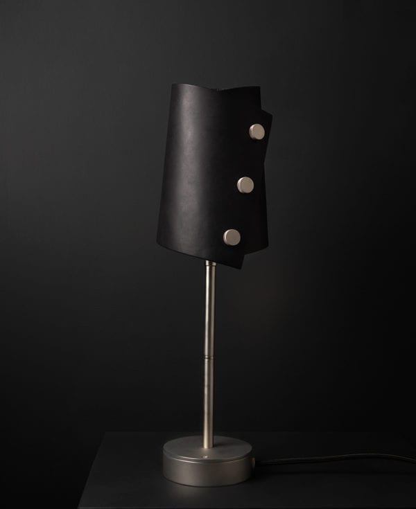 Black and Silver Leather Cuff Table Lamp against black background