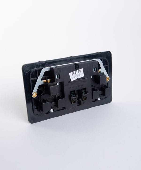 back view of double switched socket back plate against white background