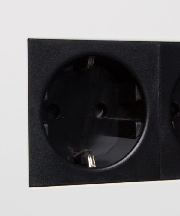 white and black double schuko socket close up