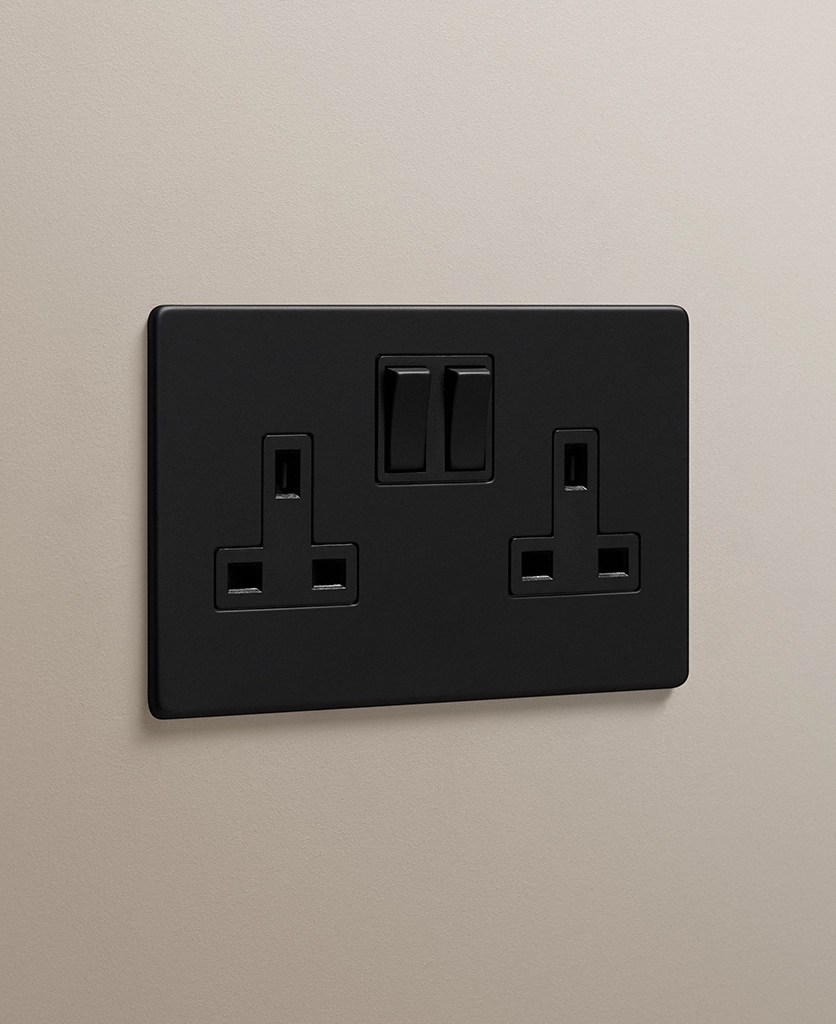 matt black 2 gang double plug socket on a neutral taupe wall