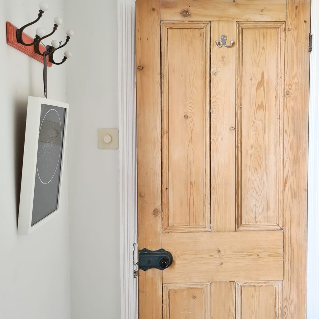 calming colours whipped cream chunky dimmer switch on white wall next to a wooden door