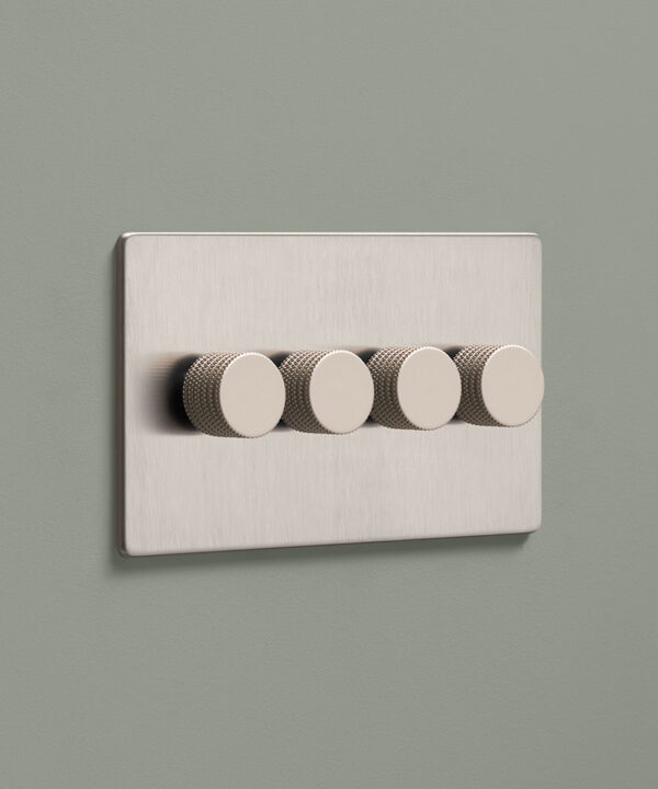silver four gang quadruple dimmer switch with four silver knurled knobs