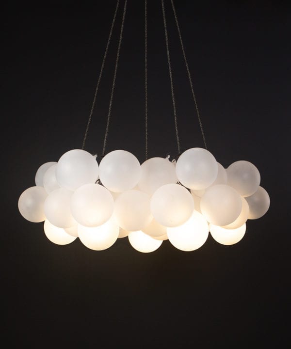 Frosted chandelier with 40 glass orbs on black background