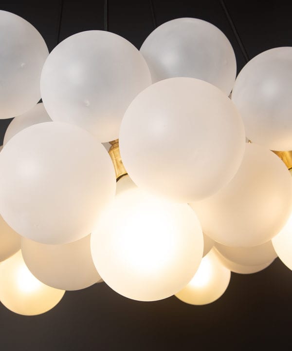 Frosted bauble chandelier with gold bulb holders close up