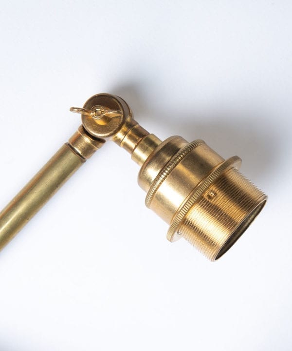 closeup of fender brass bulbholder on white background