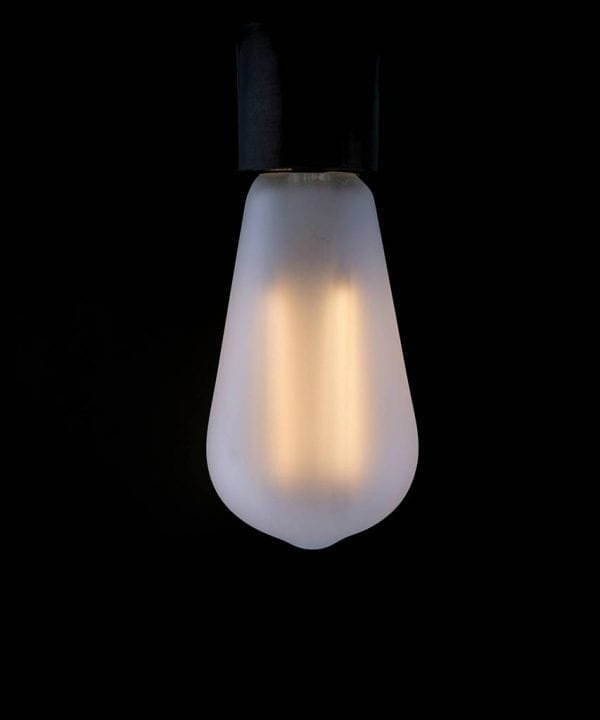 frosted pear squirrel cage filament bulb with a warm glow against a black background