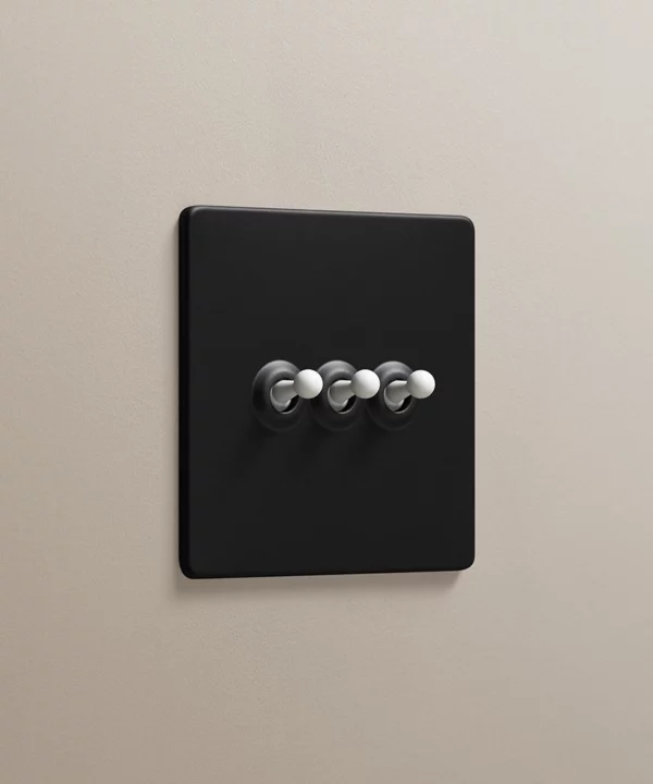 black 3 gang triple toggle switch with white toggles