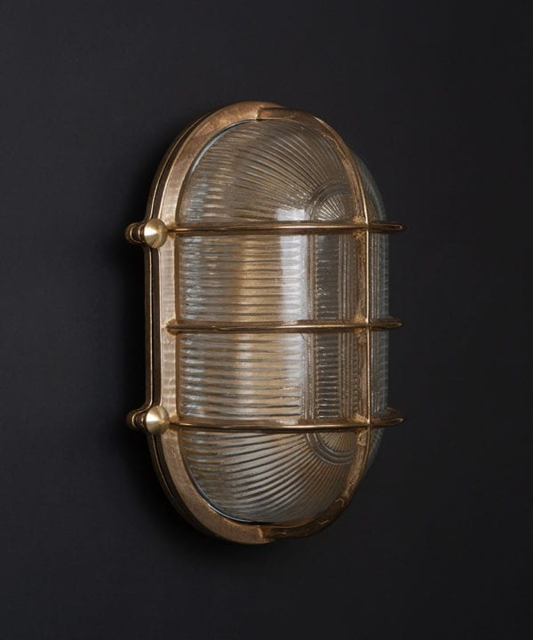 unlit brass big steve bulkhead on black wall