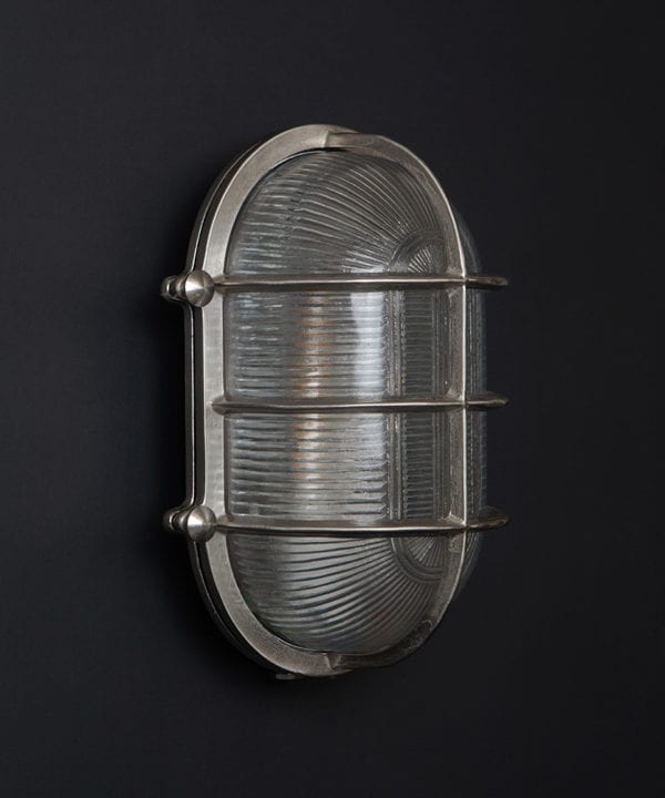 unlit silver big steve bulkhead on black wall