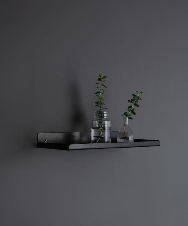 assam black shelf with glass vases on a dark grey wall