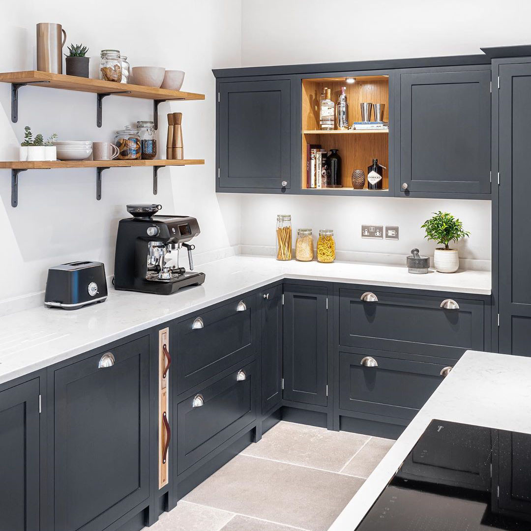 magnus shelf bracket used as open shelving in a dark grey and white kitchen