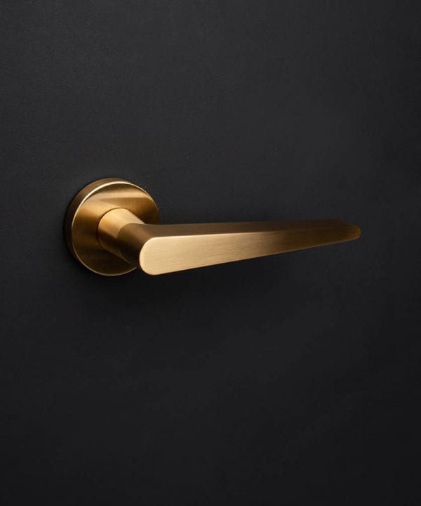 hepworth gold contemporary door handles on black background