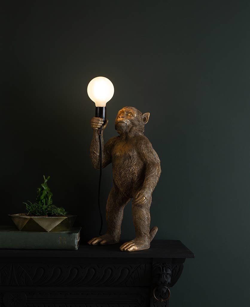 Monty Gold Standing Monkey Table Lamp against black background