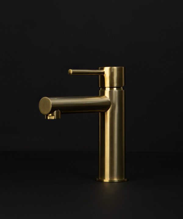 gold kagera tap on black background