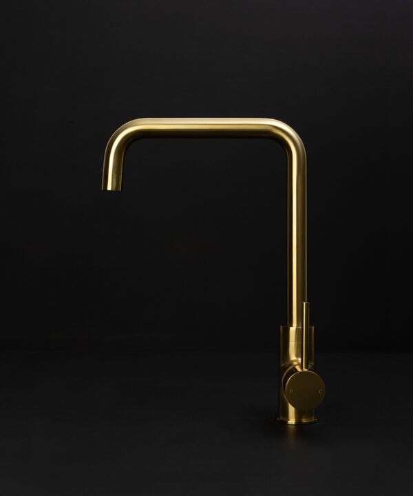 gold kintampo tap side angle on black background
