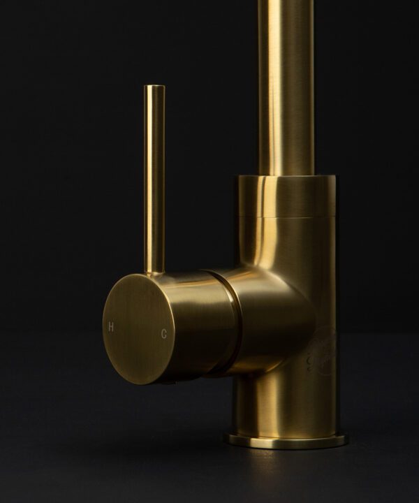 gold tinkisso tap close up of handle on black background