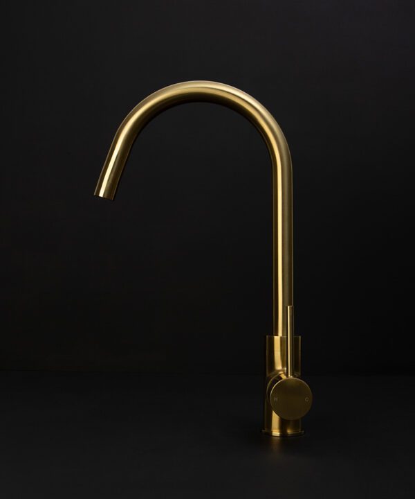 gold tinkisso tap side angle on black background