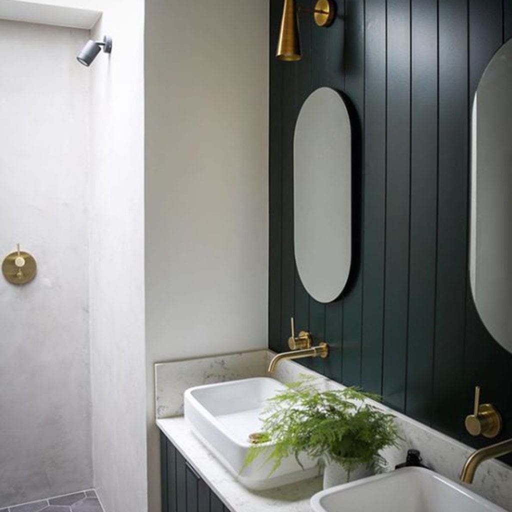 gold jadipai tap above white sink in white and dark grey bathroom