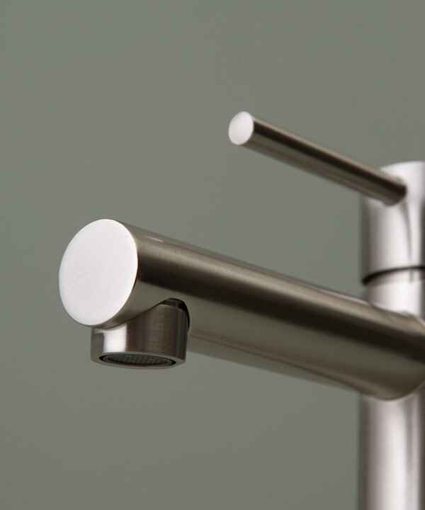 silver kagera tap spout close up on grey-green background