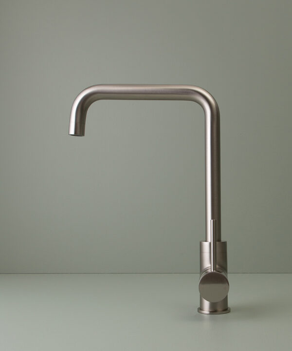 silver kintampo tap side angle shot on grey-green background